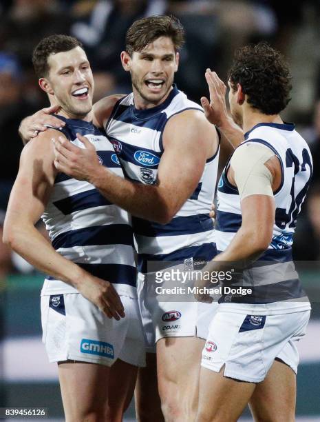 Sam Menegola Tom Hawkins and Steven Motlop of the Cats celebrates a goal during the round 23 AFL match between the Geelong Cats and the Greater...