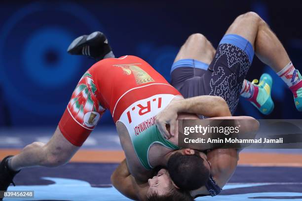 Amir Mohsen Mohammadi of Iran in action against Aliaksandr Hushtyn of Belarus during World Wrestling Championships in qualification freestyle Seniors...