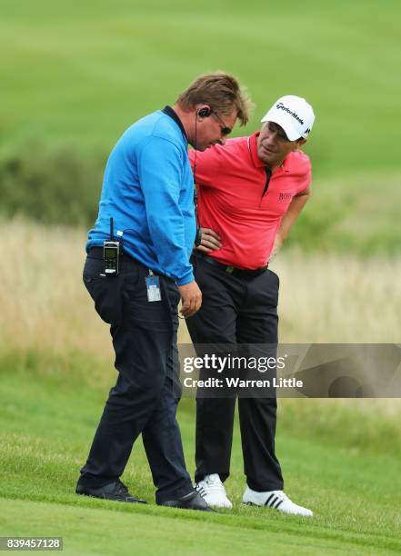 Steve Webster of England is given a ruling by referee Neil Briggs on the 7th hole during day three of the Made in Denmark at Himmerland Golf & Spa...