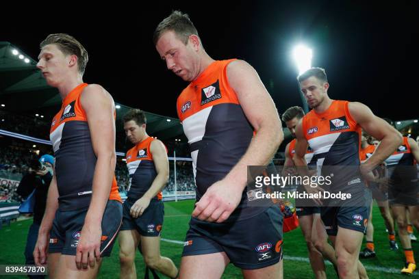 Steve Johnson of the Giants looks dejected after defeat with Lachie Whitfield of the Giants during the round 23 AFL match between the Geelong Cats...