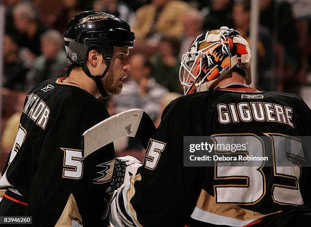 Steve Montador and Jean-Sebastien Giguere of the Anaheim Ducks talk on the ice during the game against the Columbus Blue Jackets on December 7, 2008...