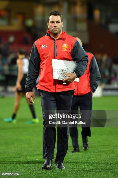 Suns interim head coach Dean Solomon walks from the field after during the round 23 AFL match between the Port Adelaide Power and the Gold Coast Suns...