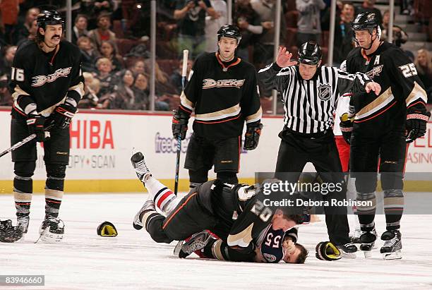 Ole-Kristian Tollefsen of the Columbus Blue Jackets fights with Ryan Carter of the Anaheim Ducks during the game on December 7, 2008 at Honda Center...