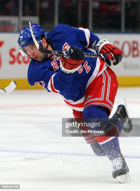 Chris Drury of the New York Rangers shoots the puck against the Calgary Flames on December 7, 2008 at Madison Square Garden in New York City.