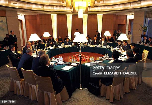 Envoys from Russia, US, North Korea, Japan, China and South Korea meet at the beginning of a round of six party talks in Beijing on December 8, 2008....
