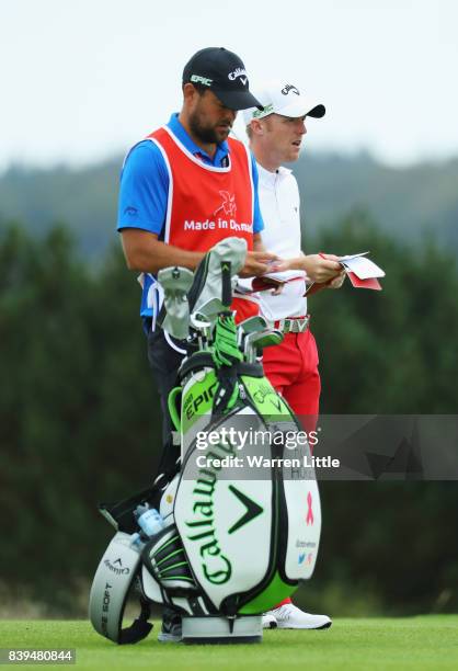 David Horsey of England checks the yardage with his caddie on the 13th hole during day three of the Made in Denmark at Himmerland Golf & Spa Resort...