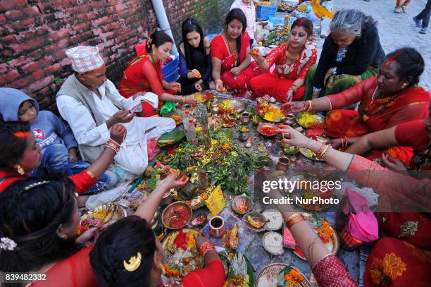 Nepalese devotees offering ritual prayer at the Bank of Bagmati River of Pashupatinath Temple during Rishi Panchami Festival celebrations at...