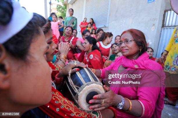 Nepalese hindu devotees playing drums and dancing at the Rishishwor Mahadev Temple during Rishi Panchami Festival celebrations at Teku, Katmandu,...