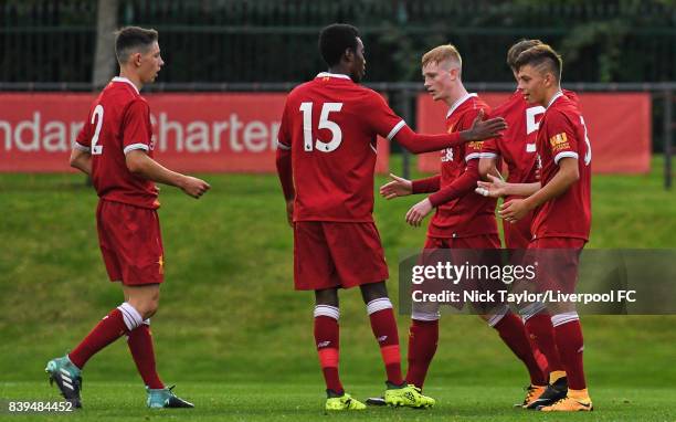 Geln McAuley of Liverpool celebrates his second goal with team mates Jordan Hunter, Rafael Camacho, Anthony Glennon and Adam Lewis during the...