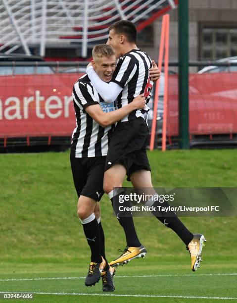 Lewis Cass of Newcastle United celebrates his goal with team mate Kelland Watts during the Liverpool v Newcastle United U18 Premier League game at...