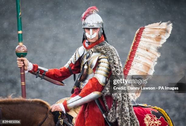 Panned exposure showing a winged Hussars cavalryman during a displaying at the Royal Armouries in Leeds.