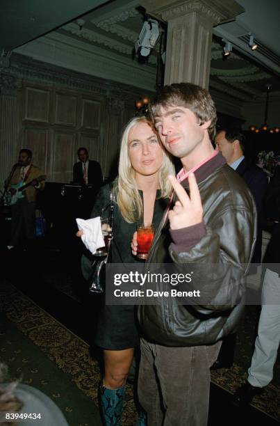 Guitarist and songwriter Noel Gallagher of rock group Oasis, with his girlfriend Meg Mathews, at the premiere of 'Mission: Impossible' at the Empire...