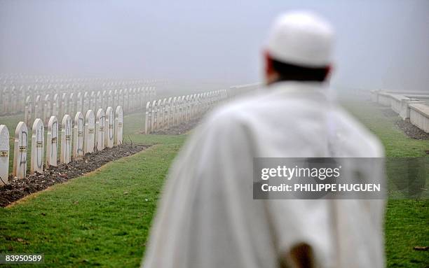 French representatives of the Islamic community stands on December 8, 2008 at Notre-Dame-de-Lorette cemetery in Ablain-Saint-Nazaire near the...