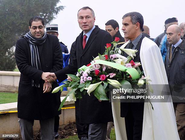 French junior defence minister Jean-Marie Bockel walk with representatives of the Islamic community on December 8, 2008 at Notre-Dame-de-Lorette...