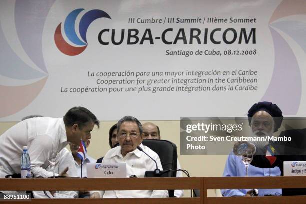 President Raul Castro of Cuba talks with Foreign Minister Felipe Perez Roque of Cuba prior to the opening session of the third CARICOM summit, a...