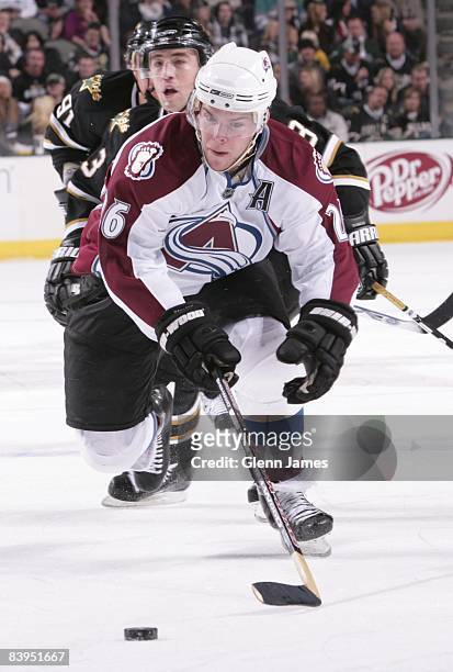 Paul Stastny of the Colorado Avalanche chases down the loose puck against Stephane Robidas of the Dallas Stars on December 5, 2008 at the American...