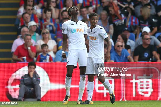 Tammy Abraham of Swansea City celebrates scoring his sides first goal with Kyle Naughton of Swansea City during the Premier League match between...