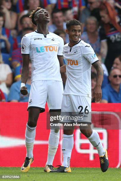 Tammy Abraham of Swansea City celebrates scoring his sides first goal with Kyle Naughton of Swansea City during the Premier League match between...