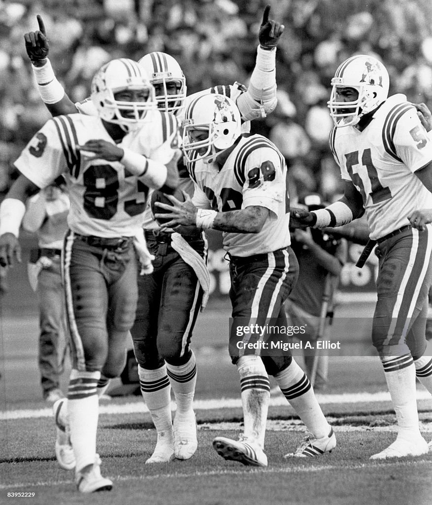 1985 Patriots Roster New England Patriots safety Jim Bowman is congratulated by teammates ...