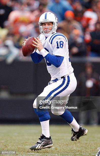 Quarterback Peyton Manning of the Indianapolis Colts looks to make a pass play during their NFL game against the Cleveland Browns on November 30,...