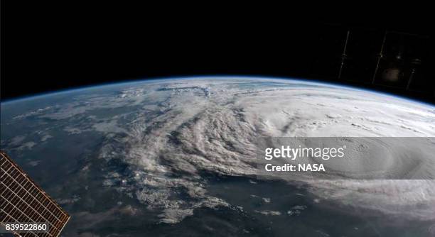 In this NASA handout image, Hurricane Harvey is photographed aboard the International Space Station as it intensified on its way toward the Texas...