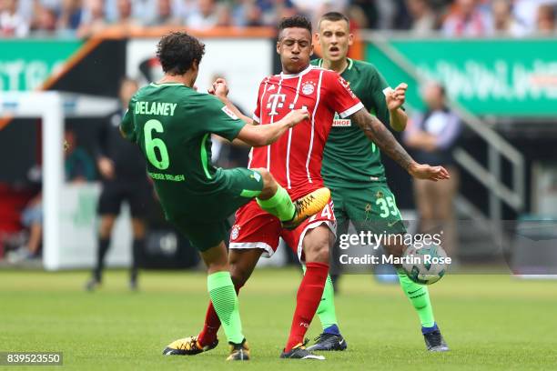 Thomas Delaney of Bremen fights for the ball with Tolisso of Bayern Muenchen during the Bundesliga match between SV Werder Bremen and FC Bayern...