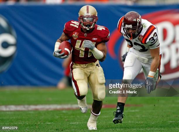 Running back Montel Harris of the Boston College Eagles runs the ball against the Virginia Tech Hokies in the 2008 ACC Football Championship game at...