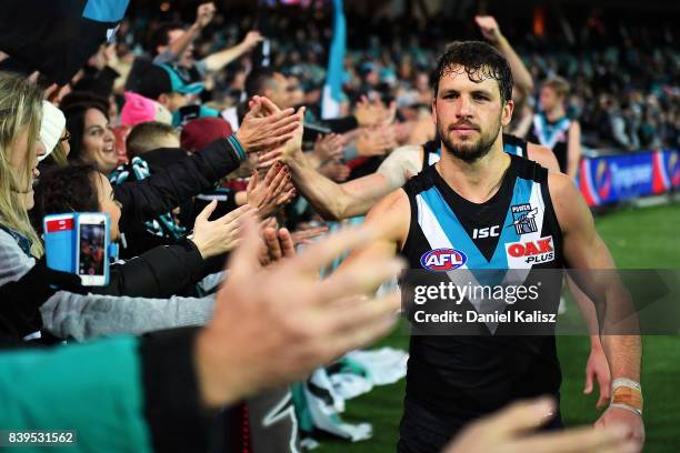 Travis Boak of the Power interacts with fans after the round 23 AFL match between the Port Adelaide Power and the Gold Coast Suns at Adelaide Oval on...