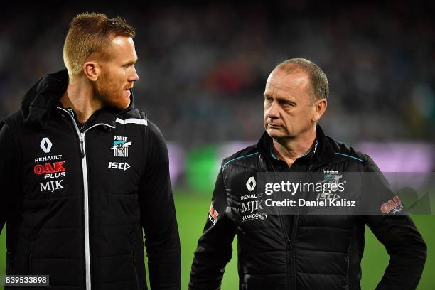 Aaron Greaves Head of Football Development for the Power chats with Ken Hinkley the coach of the Power during the round 23 AFL match between the Port...