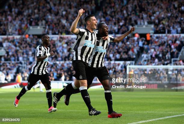 Ciaran Clark of Newcastle United celebrates scoring his sides second goal with Chancel Mbemba of Newcastle United during the Premier League match...