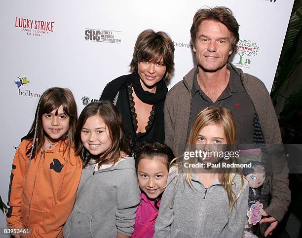 Actress Lisa Rinna, actor Harry Hamlin and family attend attends Children's Holiday Bowl and Toy Drive benefiting the Children of South L.A.'s youth...