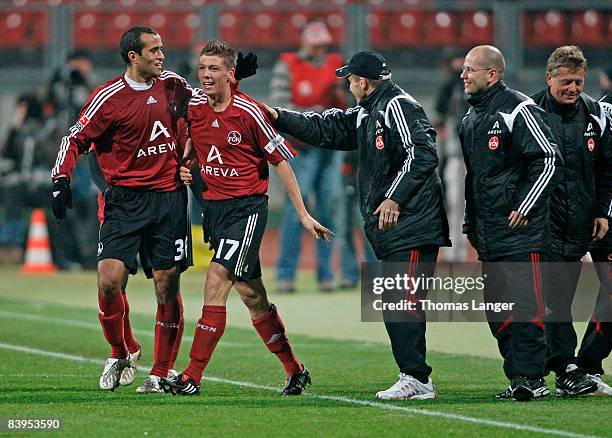 Mike Frantz and Jawhar Mnari of Nuremberg celebrate the 2-0 goal during the 2nd Bundesliga match between 1. FC Nuernberg and FC Hansa Rostock on...