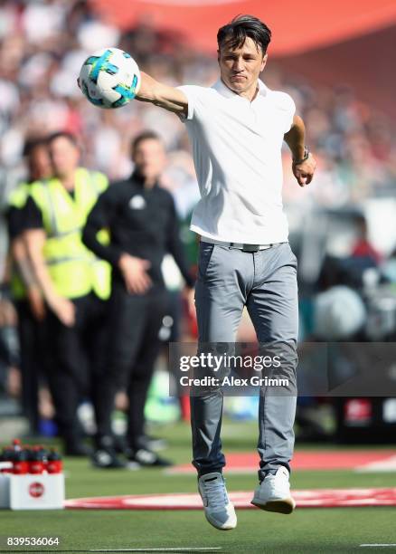 Head coach Niko Kovac of Frankfurt catches the ball during the Bundesliga match between Eintracht Frankfurt and VfL Wolfsburg at Commerzbank-Arena on...