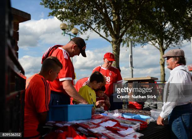 Nottingham Forest fans look at a merchandise stall before the Sky Bet Championship match between Nottingham Forest and Leeds United at City Ground on...