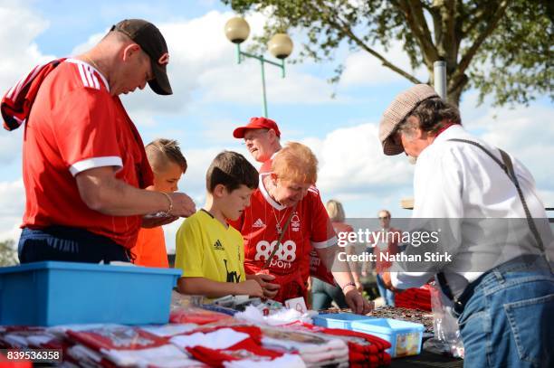 Nottingham Forest fans look at a merchandise stall before the Sky Bet Championship match between Nottingham Forest and Leeds United at City Ground on...