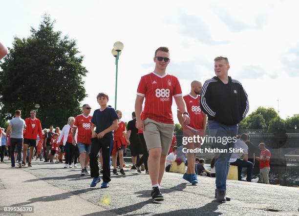 Nottingham Forest fans walk to the City Ground before the Sky Bet Championship match between Nottingham Forest and Leeds United at City Ground on...