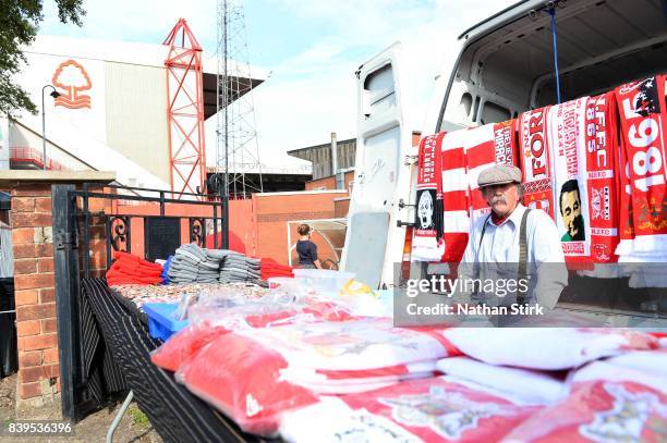 Man looks on while working on his merchandise stall before the Sky Bet Championship match between Nottingham Forest and Leeds United at City Ground...