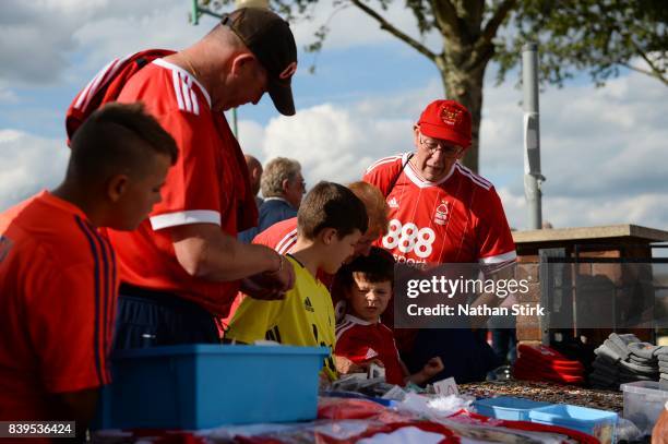 Nottingham Forest fans look at a merchandise stall before the Sky Bet Championship match between Nottingham Forest and Leeds United at City Ground on...