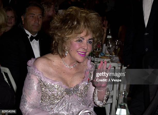 Elizabeth Taylor wearing Chandelier Diamond earrings by William Goldberg with a Chopard Diamond Necklace and Butterfly broach at A Diamond is Forever...