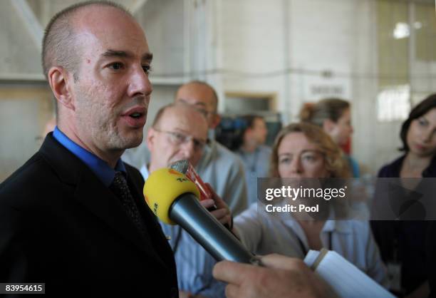 An image reviewed by the U.S. Military shows American Civil Liberties Union Executive Director Anthony Romero speaking to journalists in the hanger...