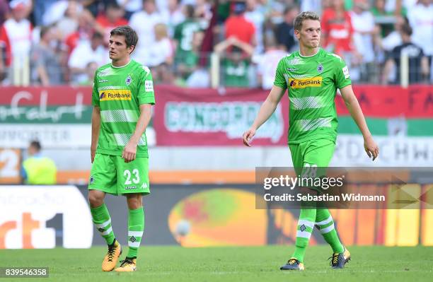 Jonas Hofmann of Moenchengladbach and Matthias Ginter of Moenchengladbach dejected after the Bundesliga match between FC Augsburg and Borussia...