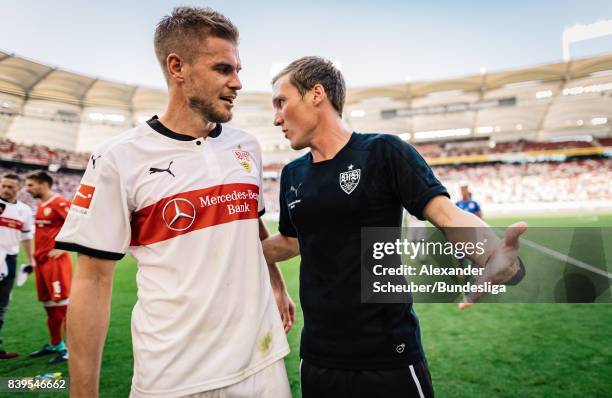 Simon Terodde of Stuttgart is seen with Head coach Hannes Wolf of Stuttgart during the Bundesliga match between VfB Stuttgart and 1. FSV Mainz 05 at...