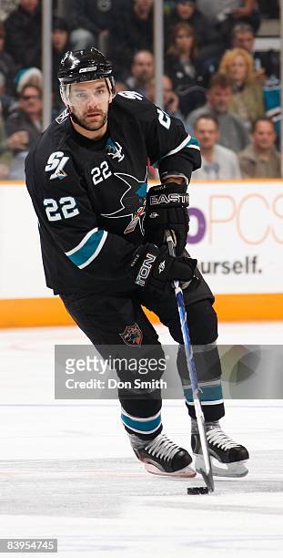 Dan Boyle of the San Jose Sharks maneuvers the puck down the ice during an NHL game against the Columbus Blue Jackets on December 4, 2008 at HP...
