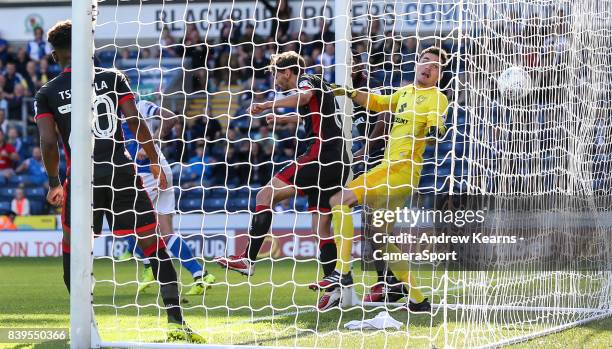 Blackburn Rovers' Charlie Mulgrew scores their third goal past goalkeeper Milton Keynes Dons' Lee Nicholls during the Sky Bet League One match...