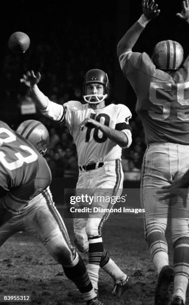 Quarterback Rudy Bukich of the Chicago Bears throws a pass during a game in the 1960s against the Detroit Lions at Tiger Stadium in Detroit, Michigan.