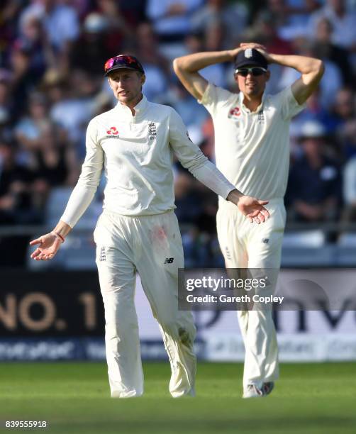 England captain Joe Root asks for a umpire review alongside Alastair Cook during day two of the 2nd Investec Test between England and the West Indies...