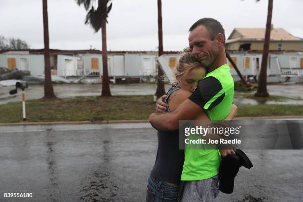 Jessica Campbell hugs Jonathan Fitzgerald after riding out Hurricane Harvey in an apartment on August 26, 2017 in Rockport, Texas. Jessica said is...