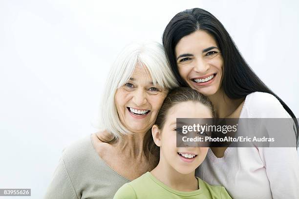 mother, daughter, and grandmother smiling at camera, portrait - three people white background stock pictures, royalty-free photos & images