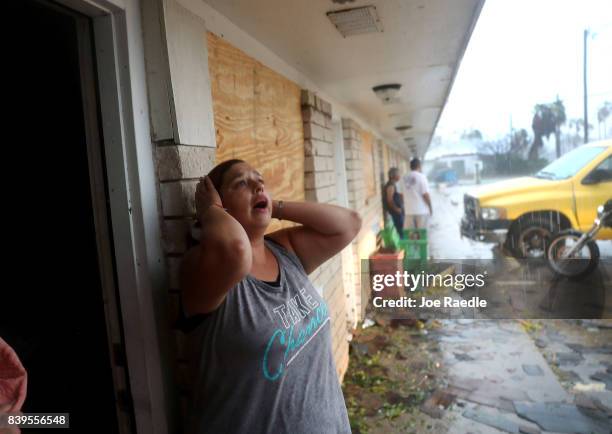 Daisy Graham reacts to the news that a friend of hers may still be in an apartment that was destroyed by Hurricane Harvey on August 26, 2017 in...