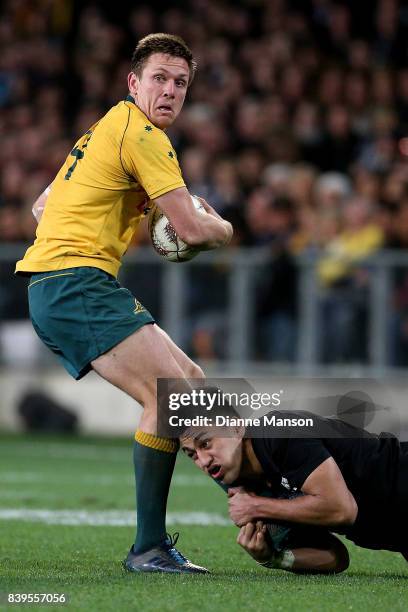 Dane Haylett-Petty of the Wallabies is tackled by Rieko Ioane of the All Blacks during The Rugby Championship Bledisloe Cup match between the New...